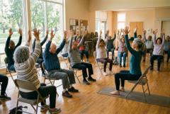 Seniors in a chair yoga class